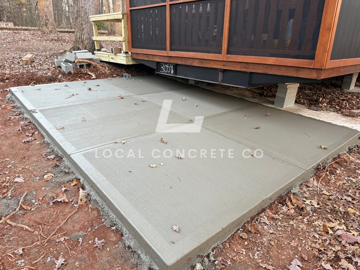 Newly poured Concrete Patios in Charlotte, NC (Mecklenburg County) by Local Concrete Charlotte — 4000 PSI mix, double-mat #4 rebar, broom-finish surface, 28-day full cure.